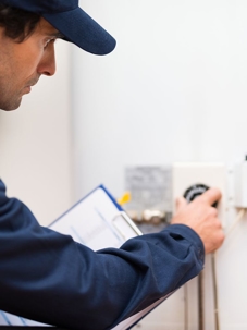 plumber checking a water heater