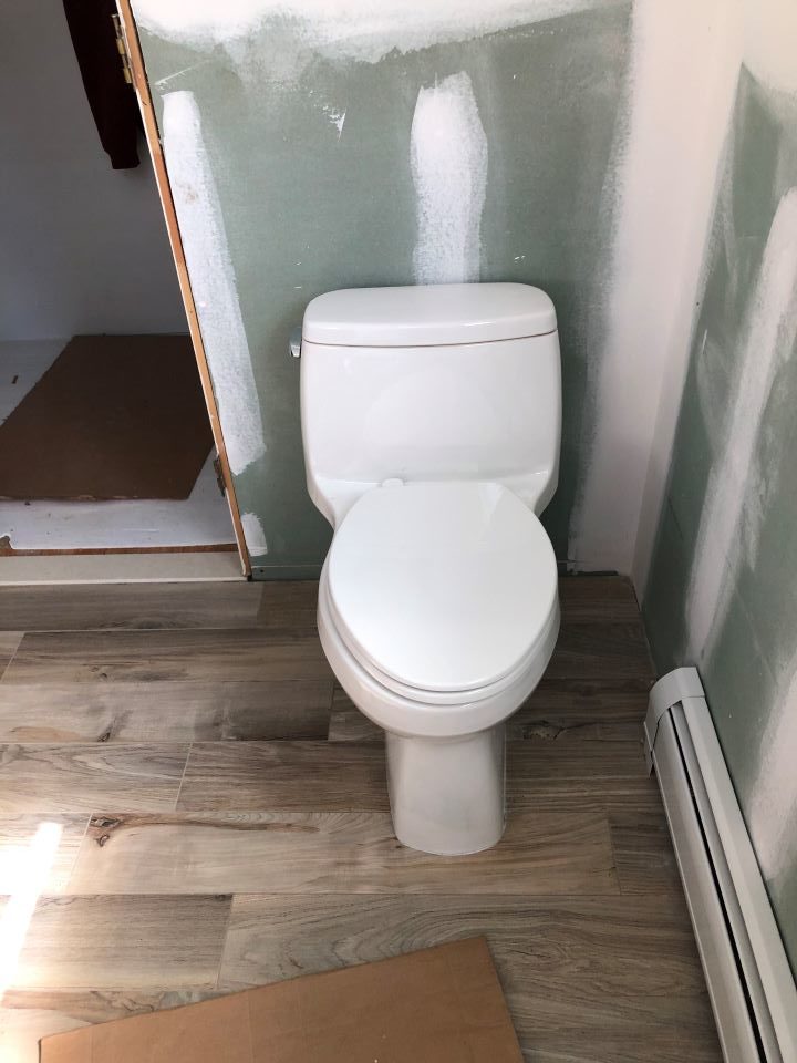 Finish Phase by Hawthorne Mechanical installing toilet in Norwood, NJ